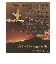 Image of an eagle lapel pin on a card with a picture of a sunset and the text of a quote by S Martin Edges