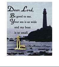 Image of a lighthouse lapel pin on a card with a picture of a lighthouse and the text: Dear Lord, Be good to me. Your sea is so wide and my boat is so small. -The Mariner's Prayer